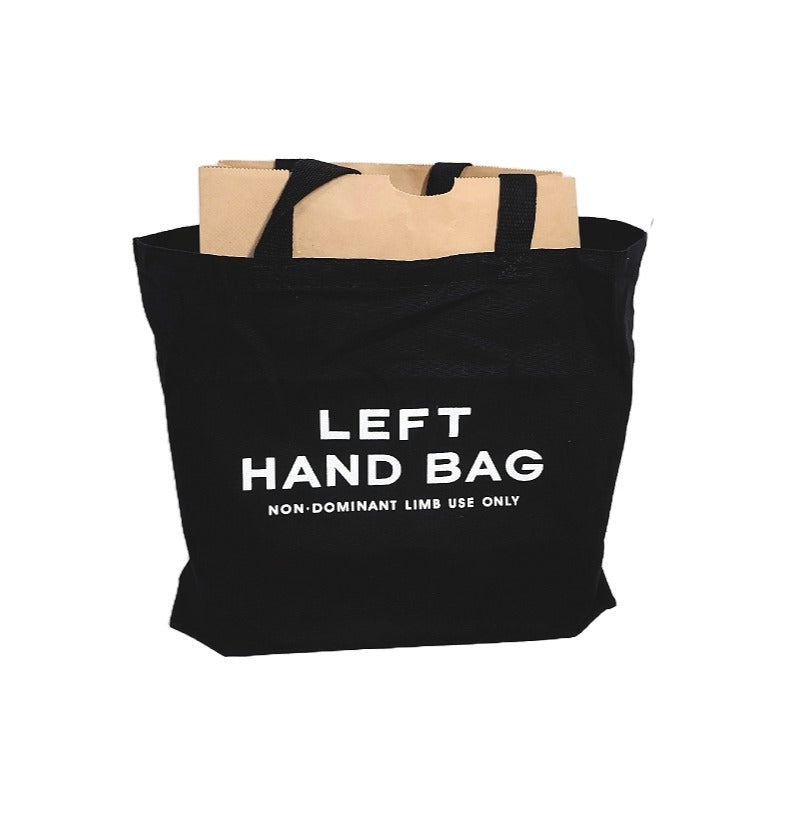 DB101 Left Hand black cotton canvas tote bag designed to lug your load with the wrong arm.